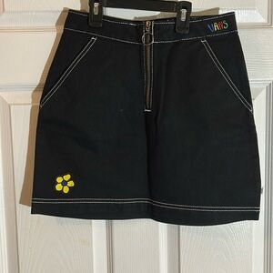 Vans Black Denim Skirt, yellow blue flower patches. Vans logo multicolored.
